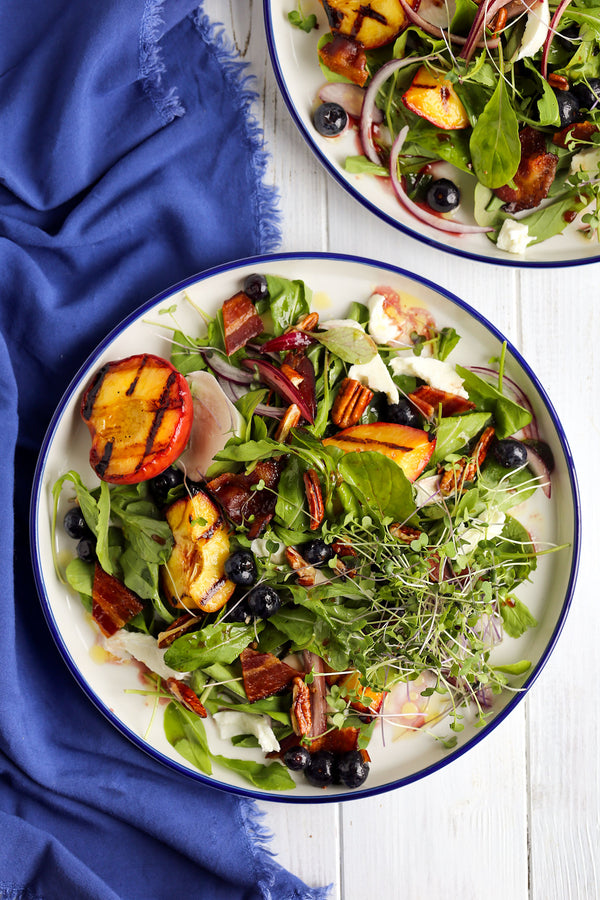 arugula peach blueberry salad dressed with balsamic blueberry vinegar