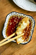 potstickers dipped in ginger soy sauce